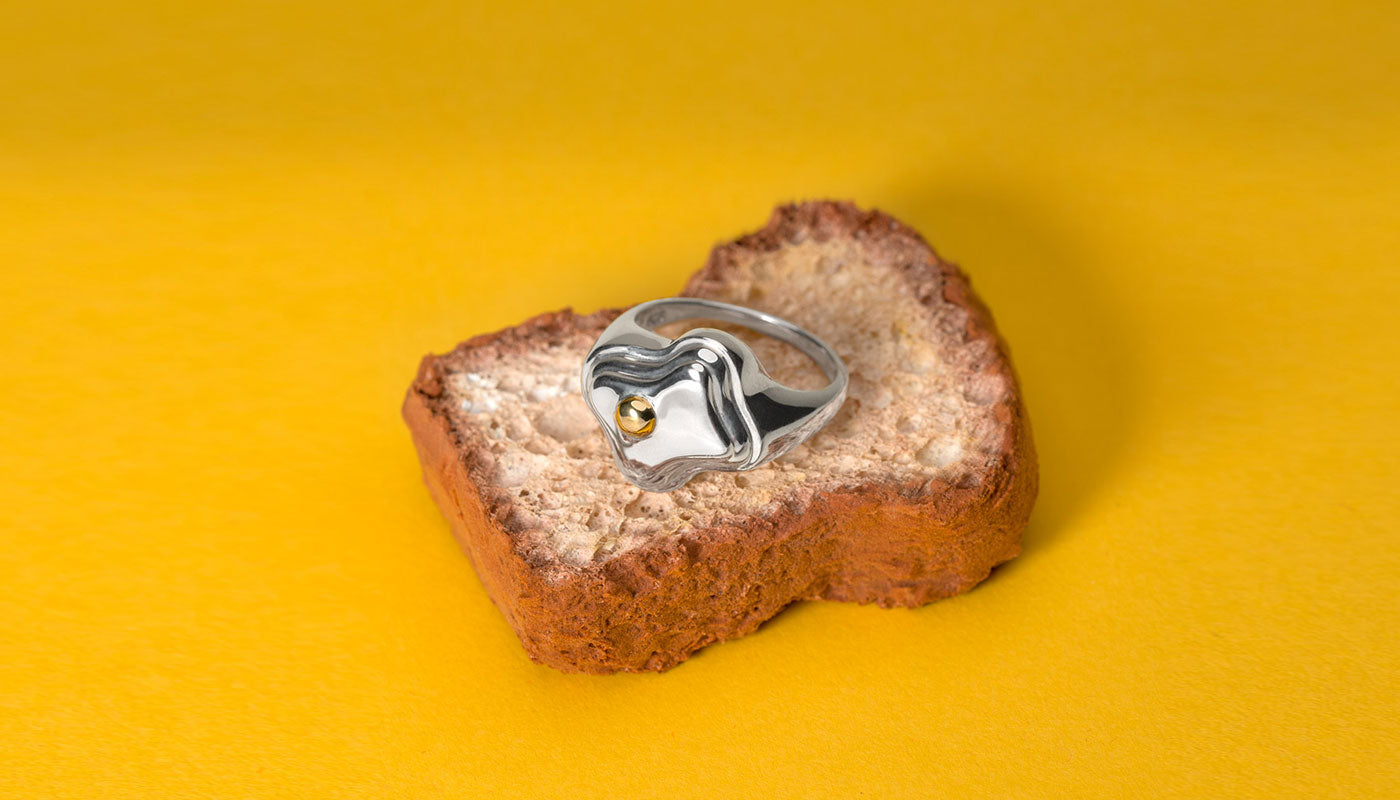 The MLE Oeuf Signet Ring on a mini toast