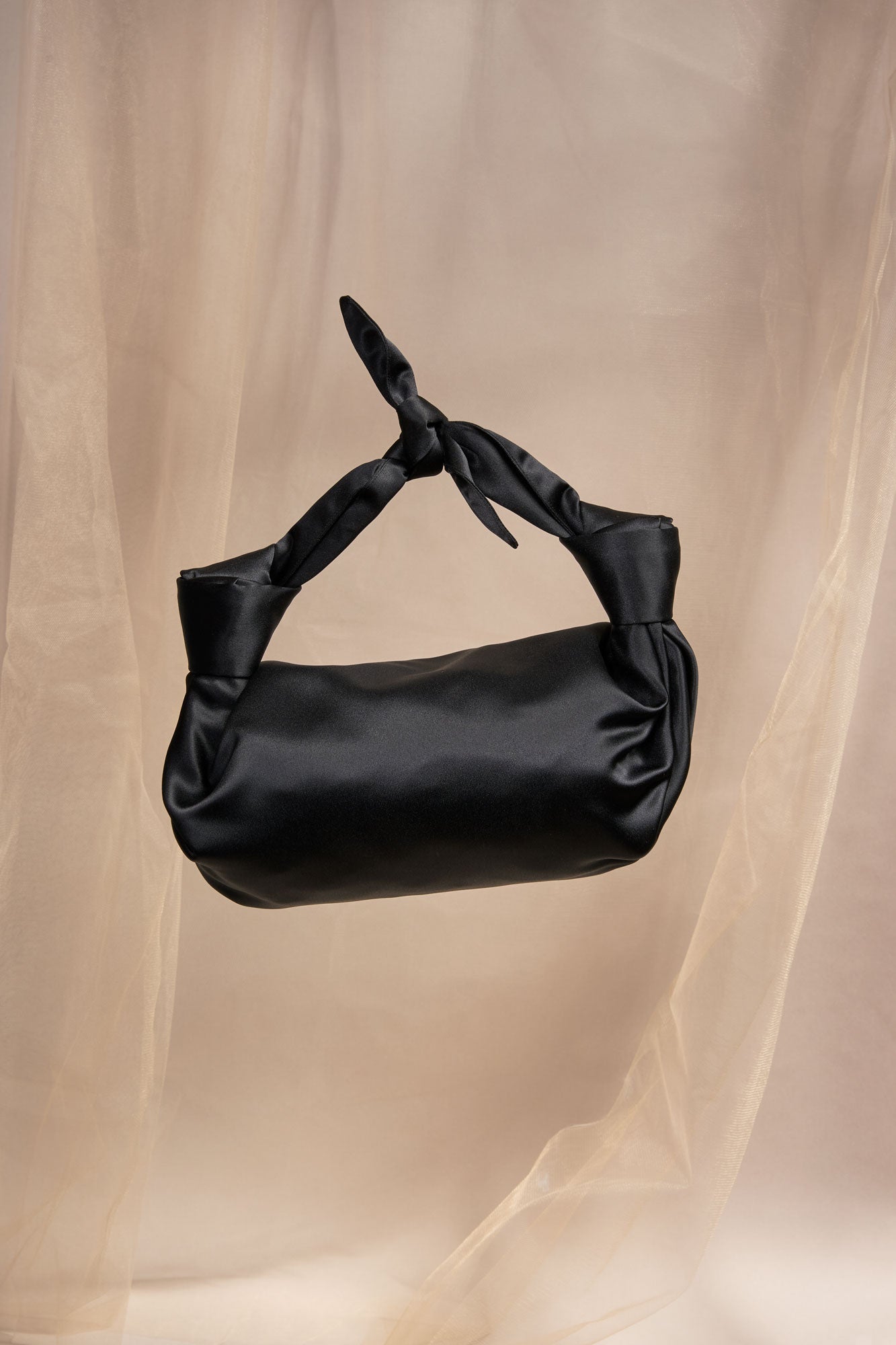 MLE Nodo Satin Mini Clutch Handbag in Black